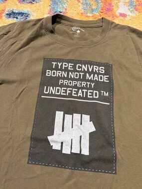 Undefeated x Converse shirt